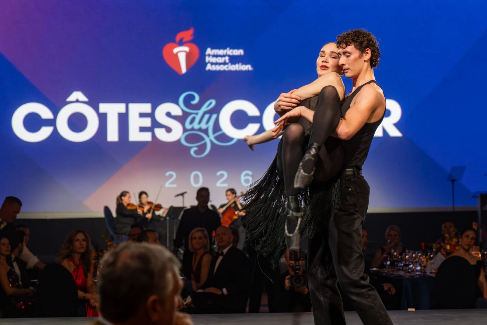 The Dallas Symphony Orchestra and the Texas Ballet Theater perform at the 2026 Côtes du Coeur gala in Dallas. (Photo by See Pink, Inc)