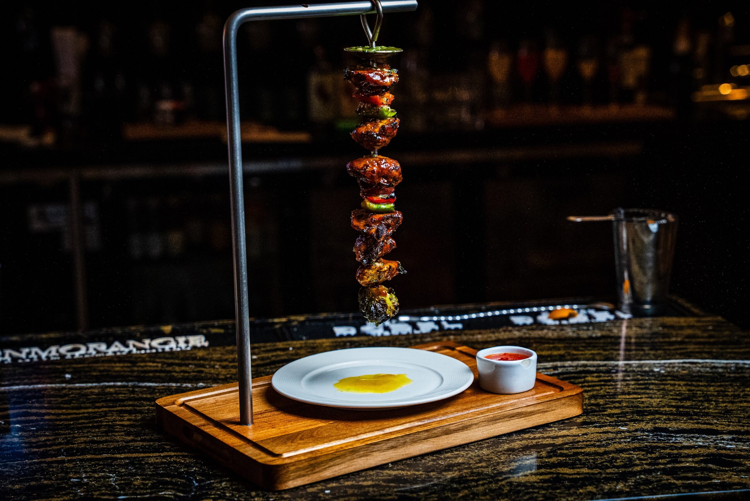 The visual star at The Chef's Table River Oaks might be the Portuguese Pendurada ($58) a beef kabob hung vertically from a pendulum-like stand brushed with garlic butter. (Photo by Emmanuel Delfin)