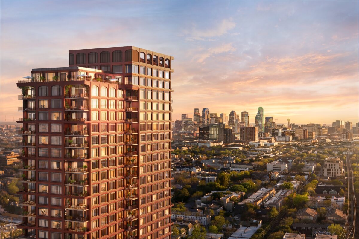 The Lora tower at sunset with the downtown Dallas skyline behind