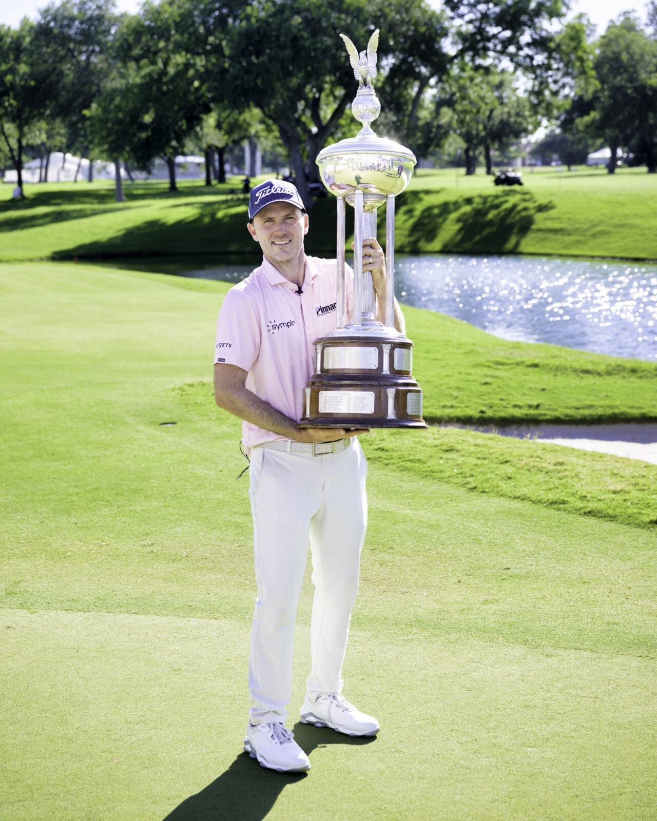 Russell Henley poses with the Charles Schwab Challenge trophy after securing his sixth PGA Tour victory. (Photo by Walt Burns)