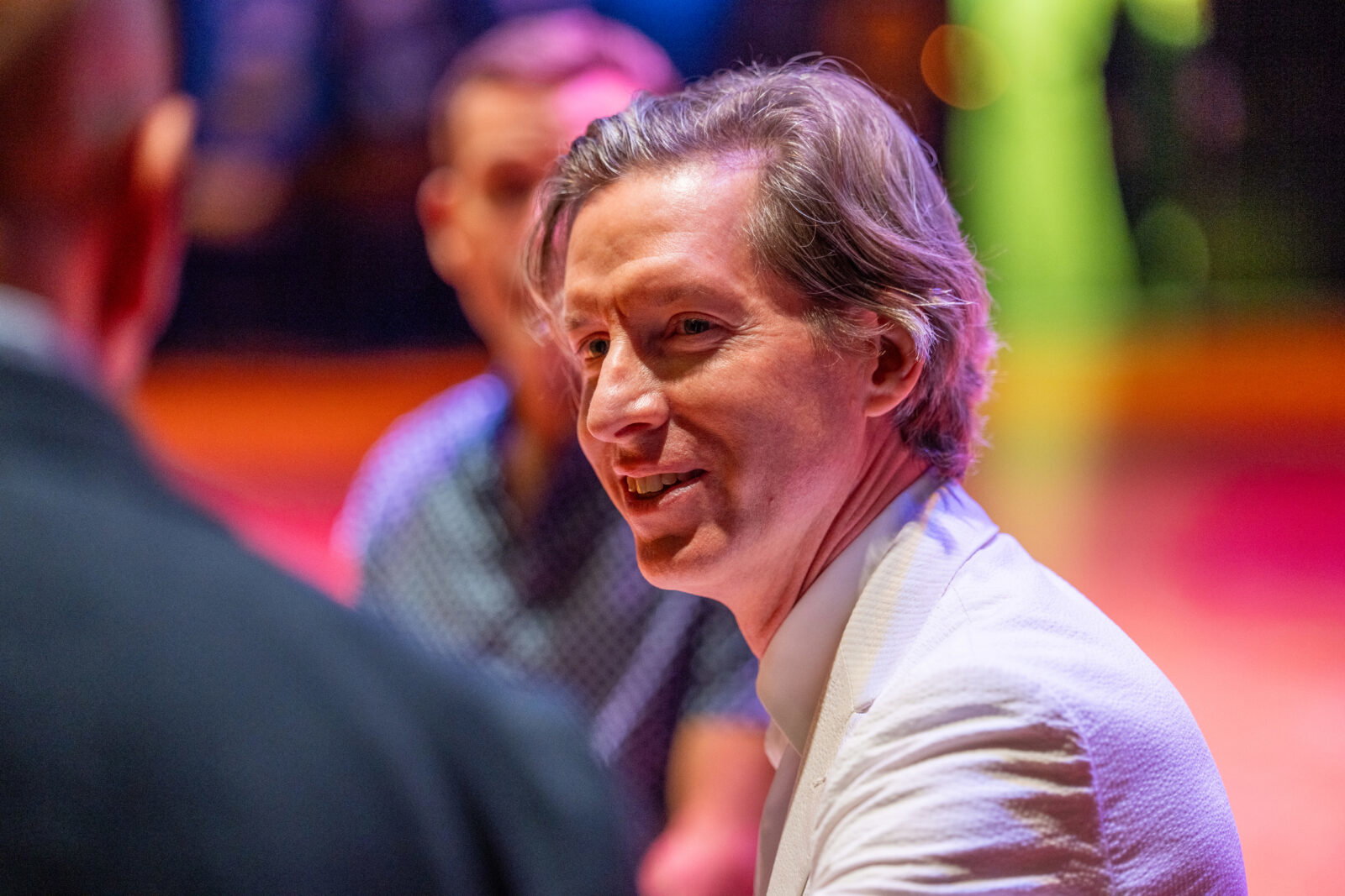 Wes Anderson shares a candid moment with Q+A moderator and friend MIke Maggart during the Homecoming event to save Garden Oaks.