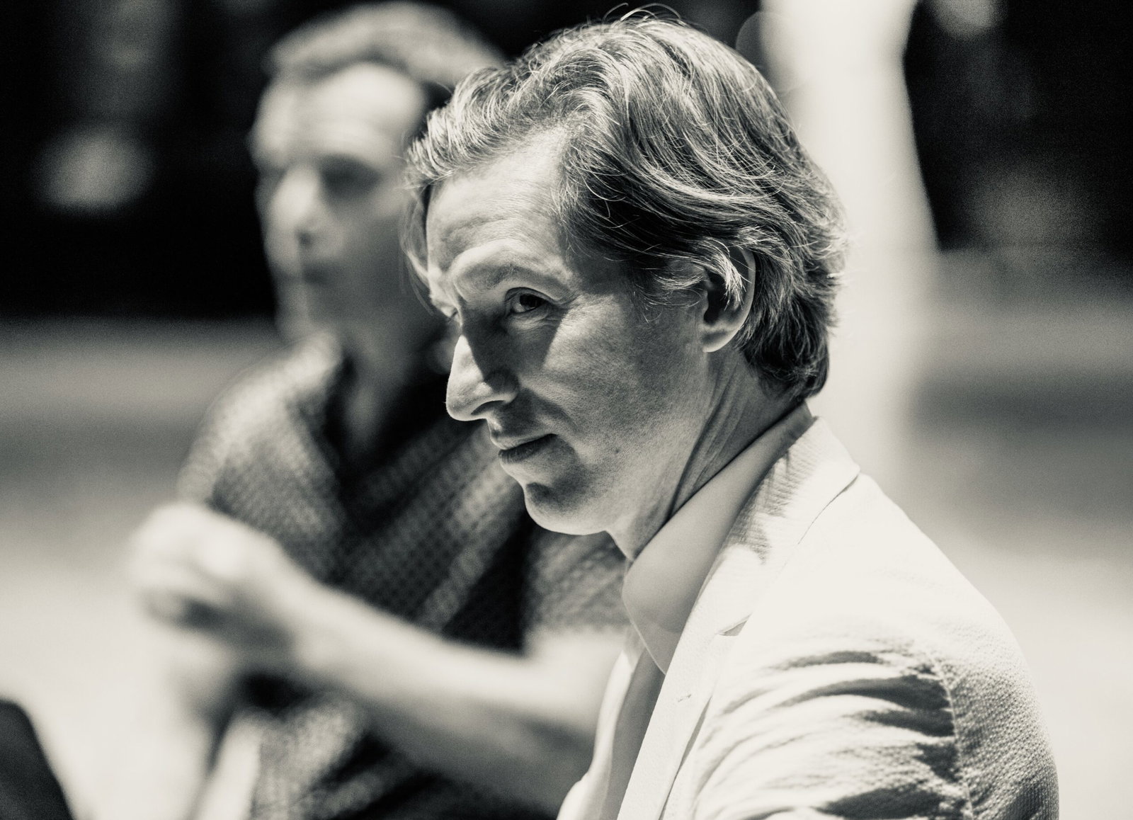 Houston-born filmmaker Wes Anderson shares a candid moment with Q+A moderator and friend MIke Maggart during Arthouse Houston's Homecoming Soirée to save Garden Oaks Theater. (Photo by Alan Nguyen)