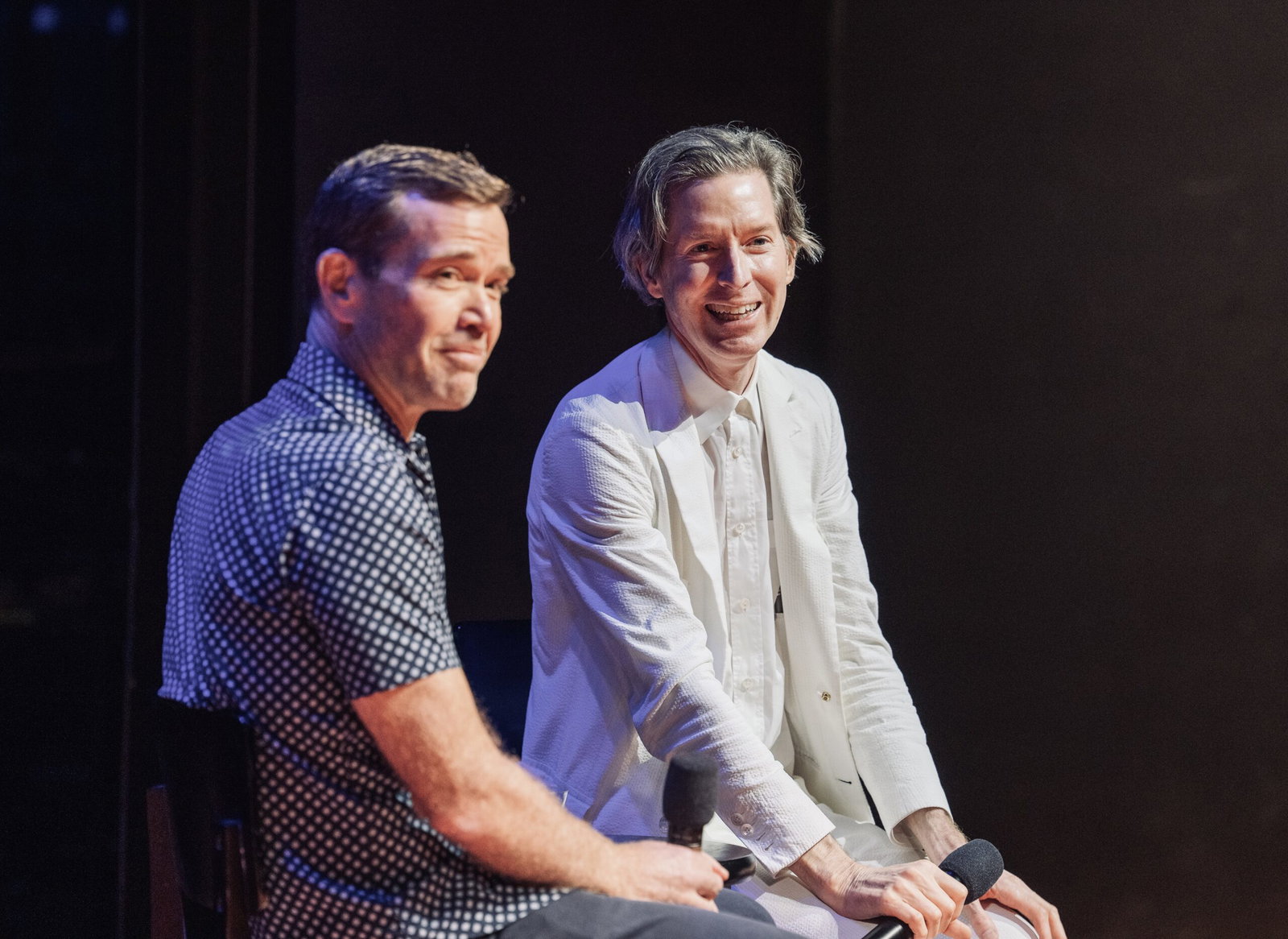 Between conversations and laughter, filmmaker Wes Anderson and moderator Mike Maggart reflect on the power of cinema in the Wes Anderson Homecoming Soirée to save Garden Oaks Theater. (Photo by Alan Nguyen)