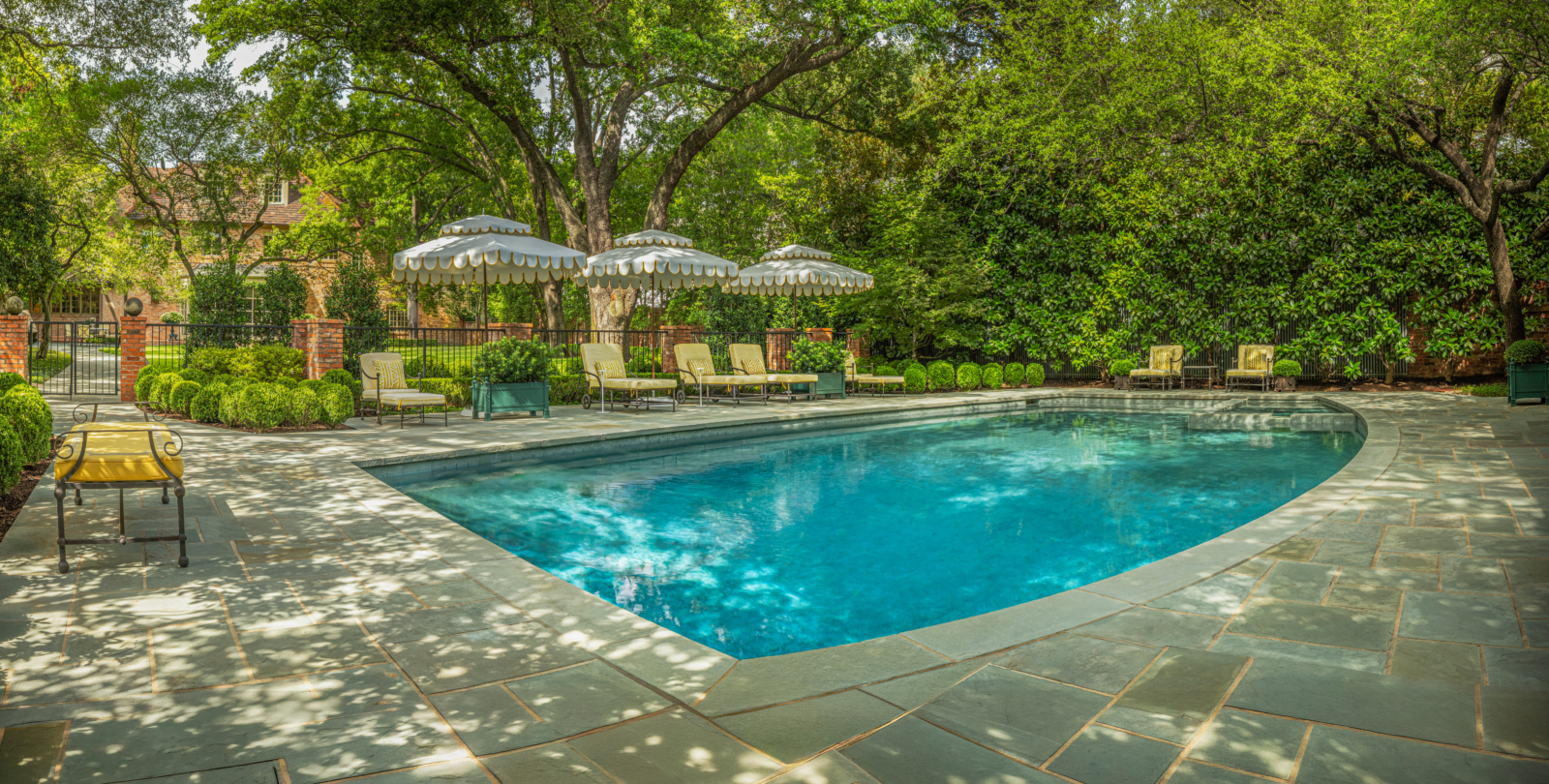 The landscape was designed not simply to surround the home, but to expand the way the family lives within it.