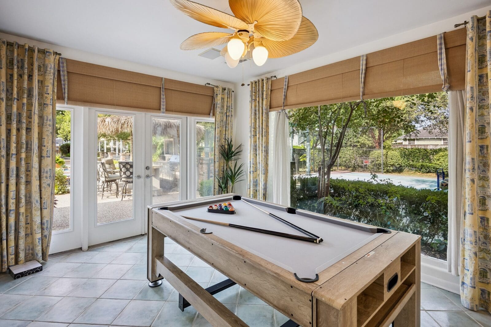 The pool house billiard room (Photo by TK Images for Martha Turner Sotheby's International Realty)