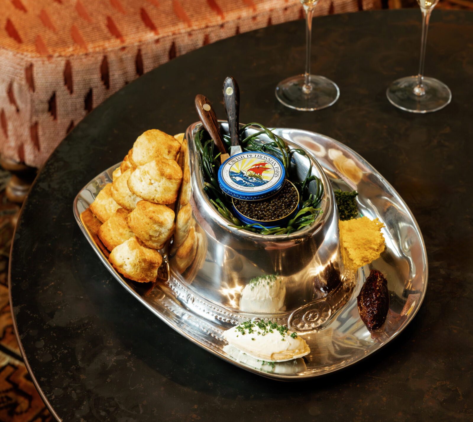 Bowie House’s signature Cowboy Caviar Service pairs Pétrossian caviar with citrus cream cheese, red onion jam, Bricks and Horses country biscuits, and house fixings. (Photo courtesy Bowie House)