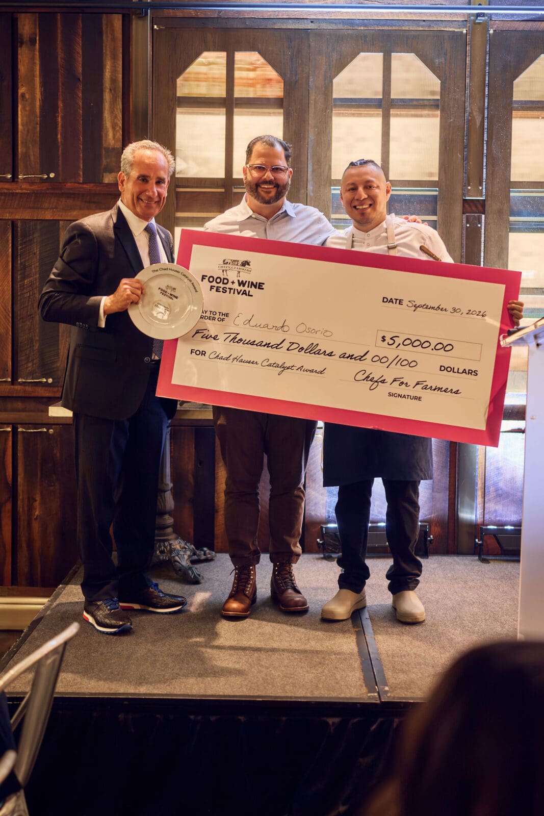 Chad Houser, founder of Café Momentum, presented the second annual Chad Houser Catalyst Award to Eduardo Osorio. (Photo by Chase Hall )