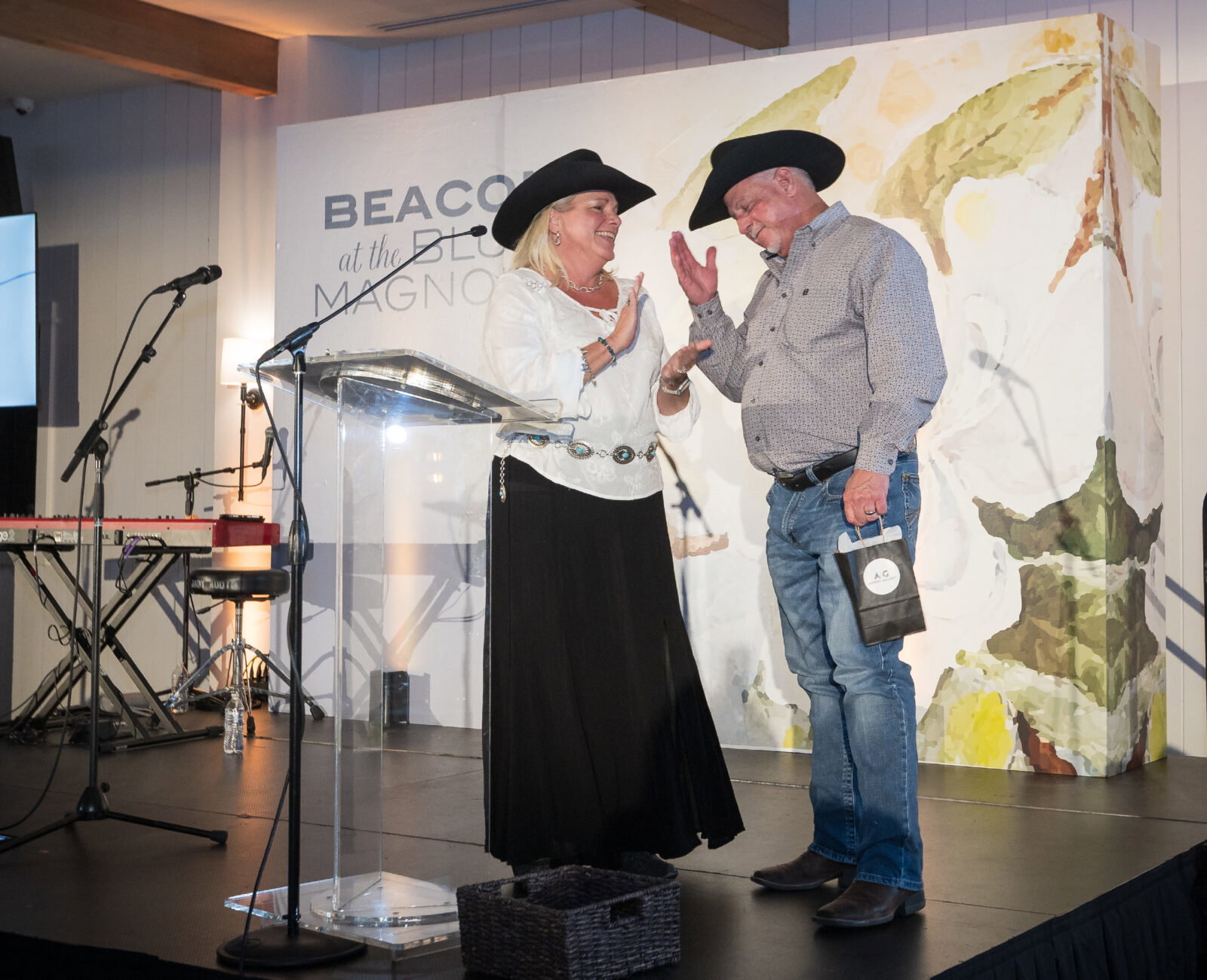 Executive Director Kelly Baughman recognized her husband Mark as Project Beacon's volunteer of the year.