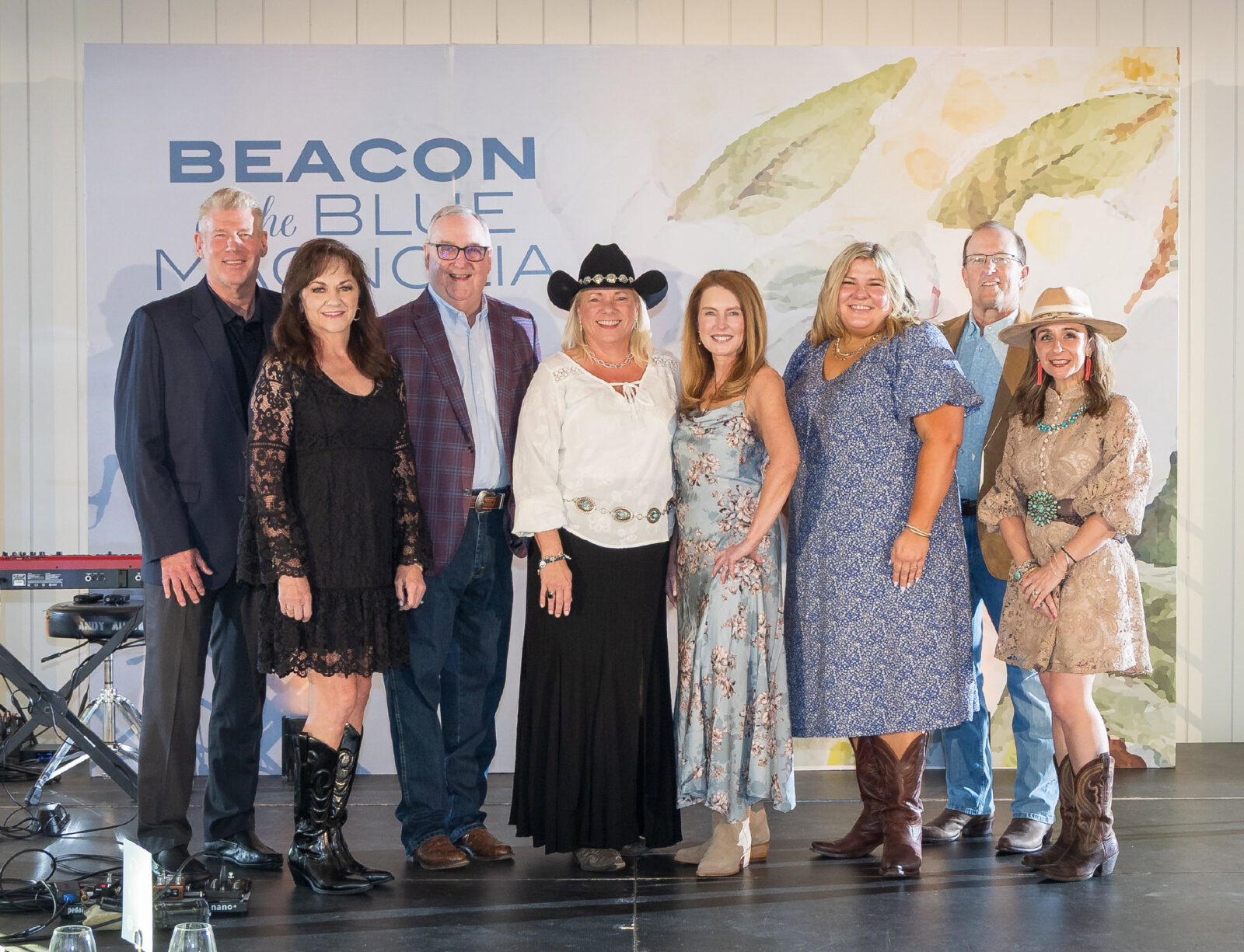 Rob Wollard, Carol Durkee, Gil Staley, Kelly Baughman, Dr. Amy Wood, Wendy Muarer, Kevin Gerrity, and Amanda Smith at Project Beacon's 2026 gala at The Blue Magnolia.