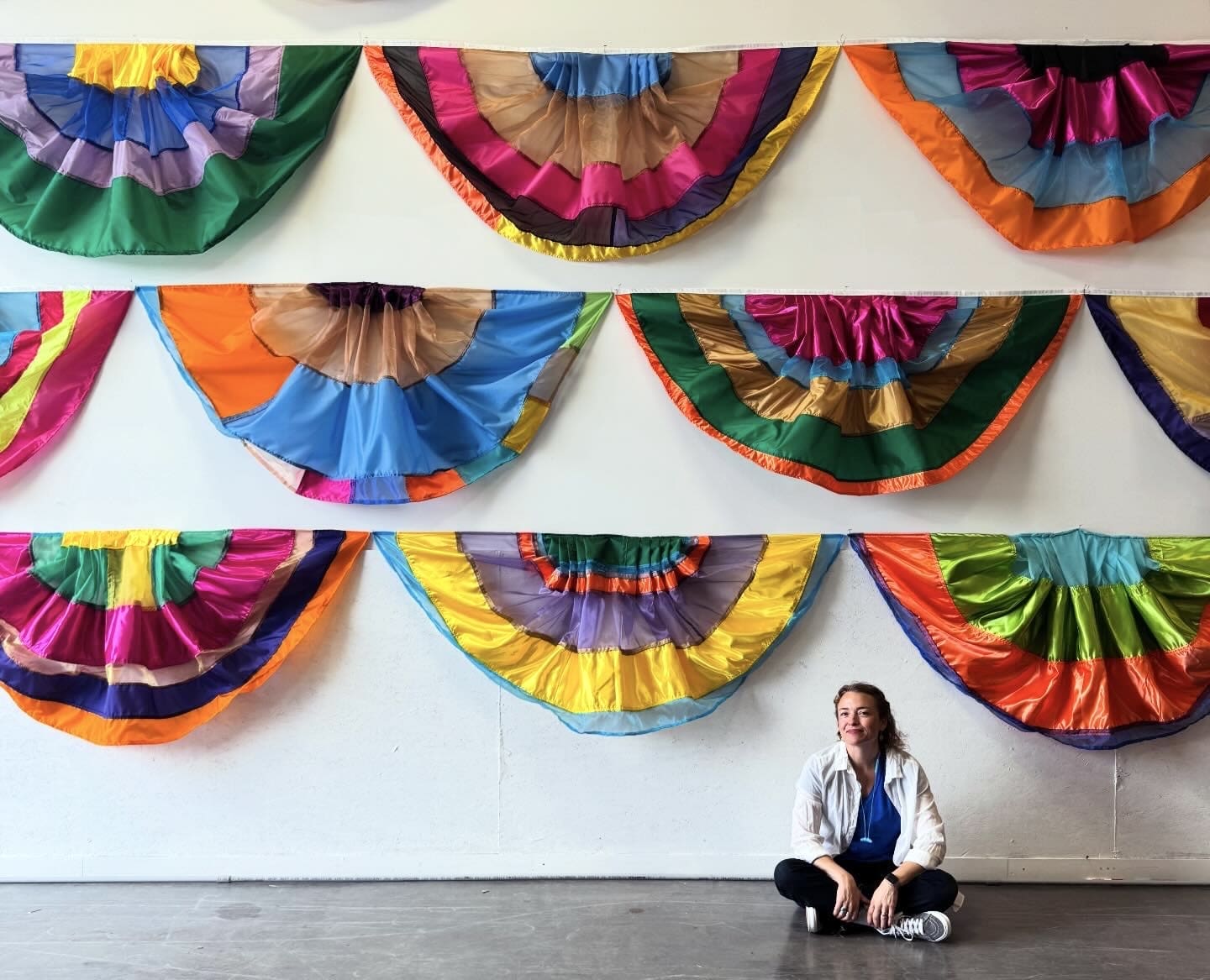 Rachel Hayes with her bunting flags and shades installed at Bull Room, Ballroom Marfa, Marfa, Texas. Houston designer Gin Braverman has tapped the Oklahoma artist to a site-specific work, "True North," to anchor Untitled Art, Houston's Public Lounge. (Photo by Eric Sall. Courtesy the artist)