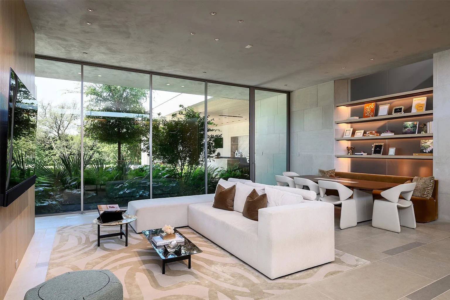 The central living spaces feature glassy, light-flooded walls. (Photo by Stephen Reed Photography)