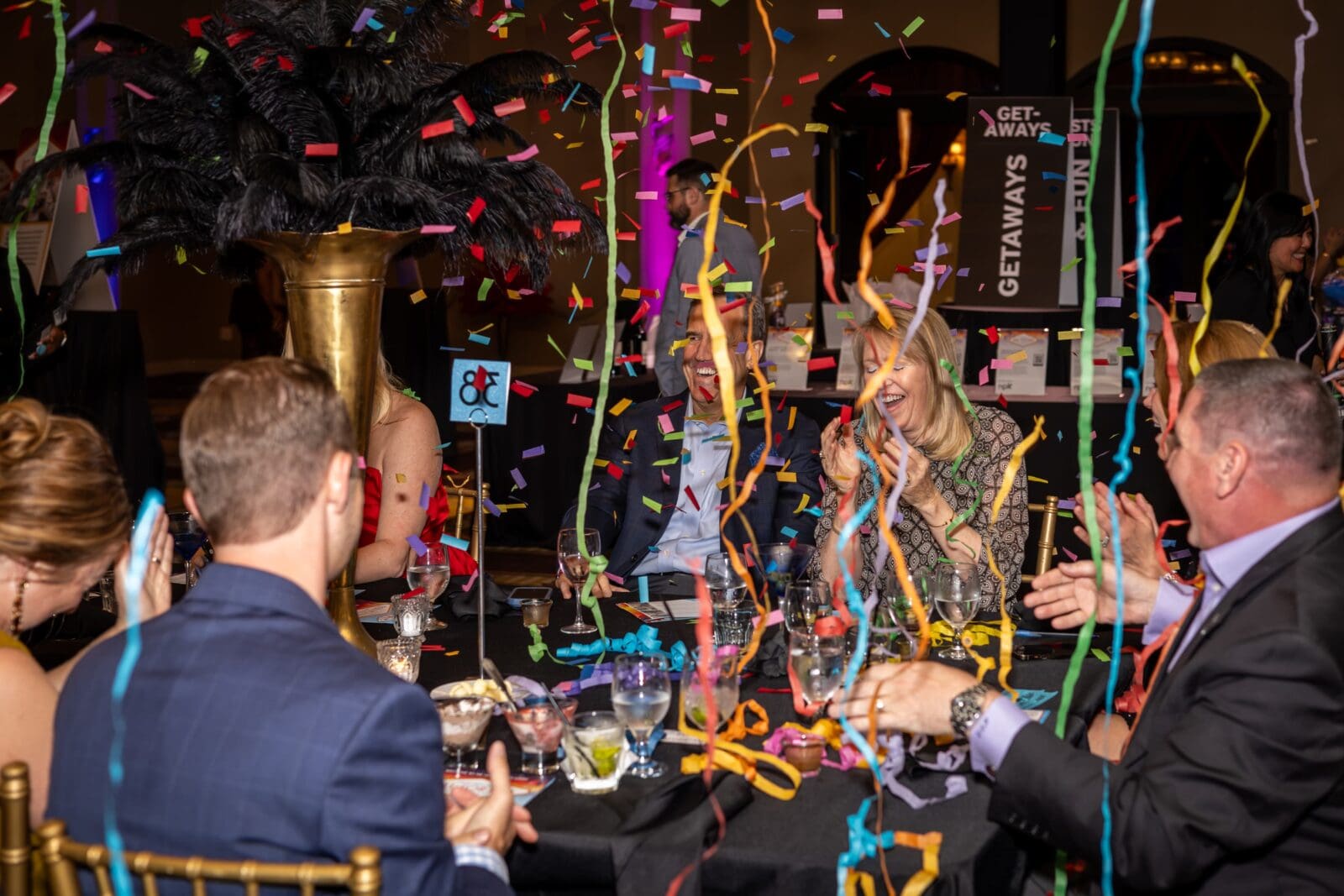 Ron & Alice Orsini caught up in the confetti celebration during the Child Advocates Pull for Kids Classic casino evening at Bayou City Event (Photo by Emily Jaschke) 