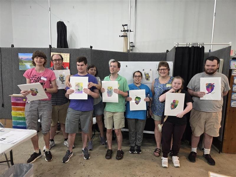 Clients show off their works in The Woodlands Art League's studio space. (Photo courtesy of Project Beacon)