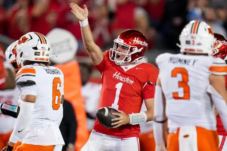 Houston quarterback Conner Weigman refused to let Oklahoma State steal his game. He never let go of the footbsll when it mattered most.