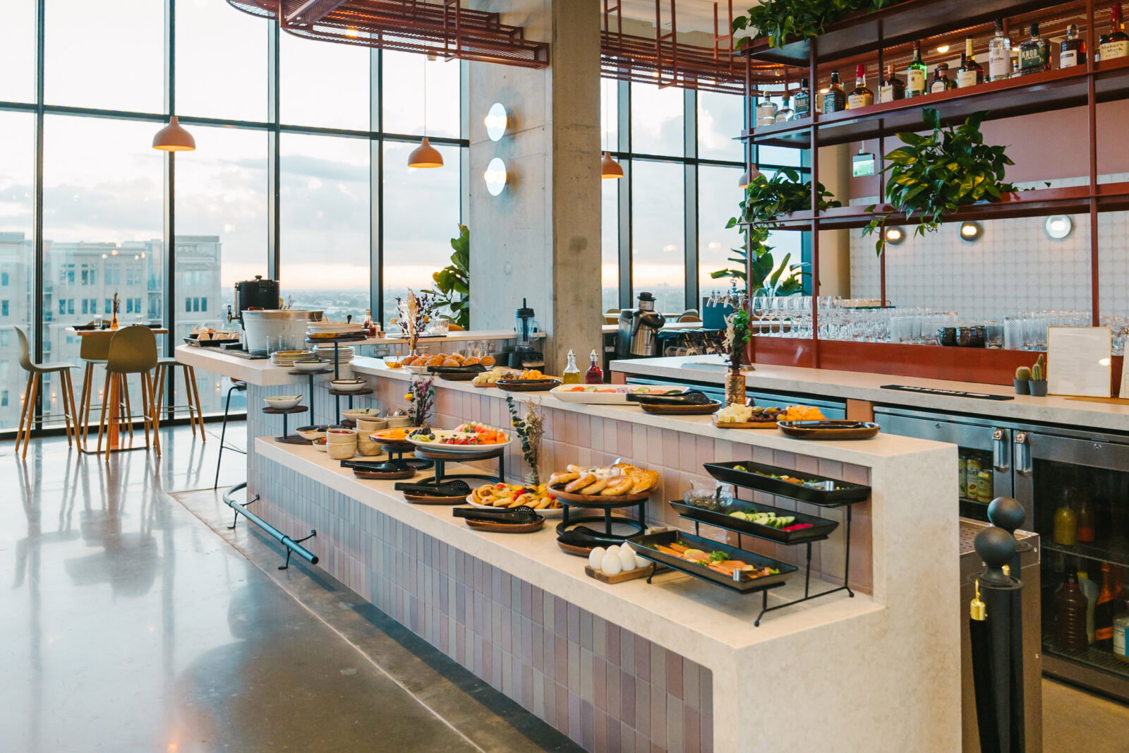 Starting at the break of dawn breakfast is served with the continental-style harvest table groaning with baked goods, fresh fruit, charcuterie, and cheese, as well as a yogurt and honey bar ($20). (Photo by Rebekah Flores)