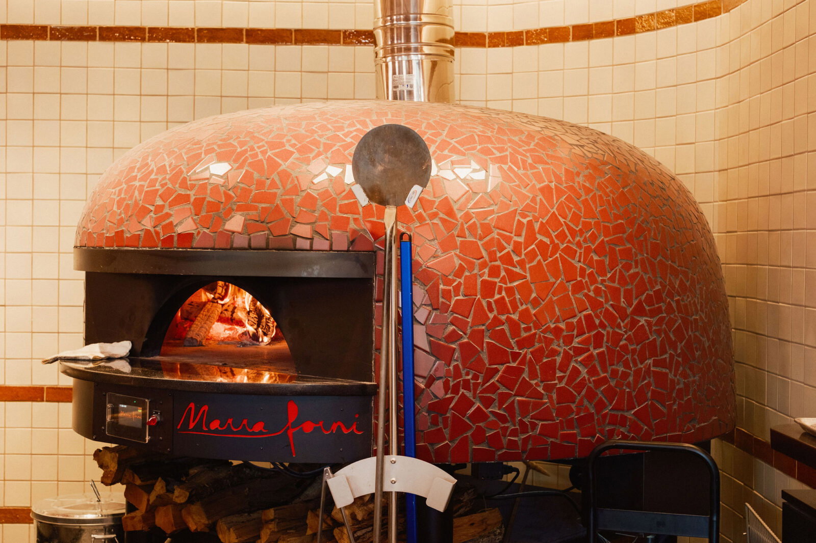 Call yourself a pizza nerd? We have the details. Creating a Neapolitan-style pie, reminiscent of his mentor Bianco’s, Angelo deviates slightly from the expected. Baked in a wood-fired oven, the cold-fermented dough with around 70% hydration, and proofed 24-48 hours is cooked at a slightly lower temperature for slightly longer time resulting in a thin, but airy, puffed crust dotted with those wonderful, crisp charred spots. (Photo by Chris Quit Nguyen)