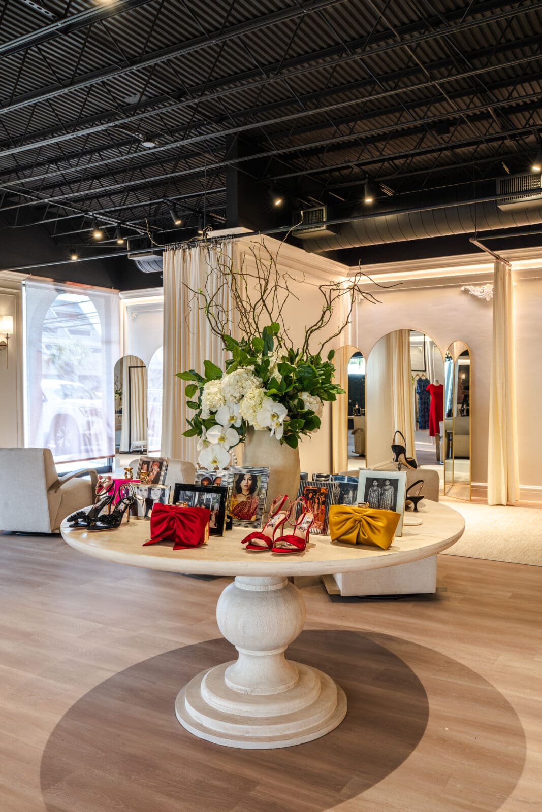 Family photos and accessories line the center table in the Sachin Bibi showroom in Houston. (Photo by Michael Anthony)