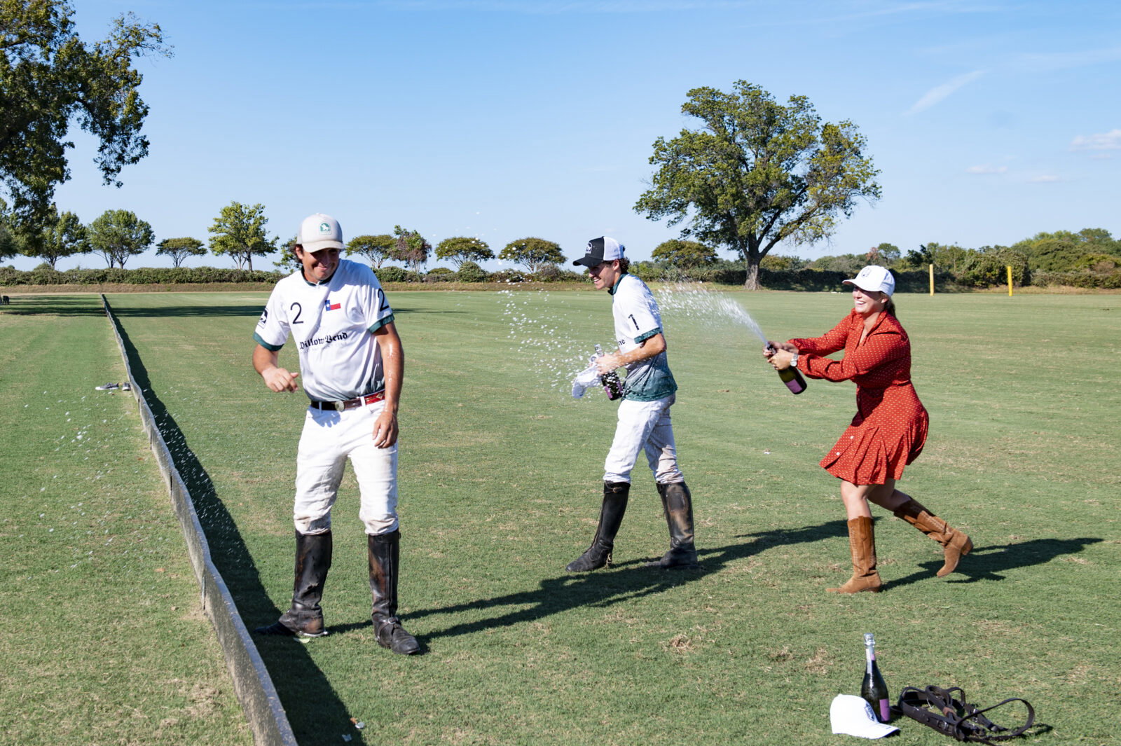 Carolyn DeVan Payne celebrating with the Polo players (Photo by Tamytha Cameron)