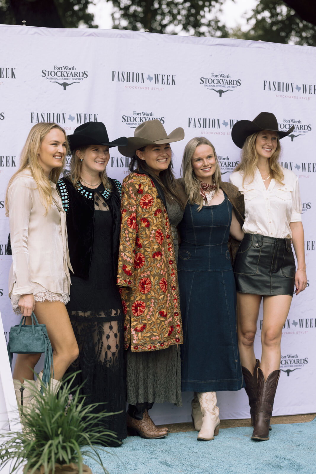 Fashion Week Stockyards Style attendees captured their favorite runway moments as models showcased the latest Western looks. (Photo by Dalton Duty)