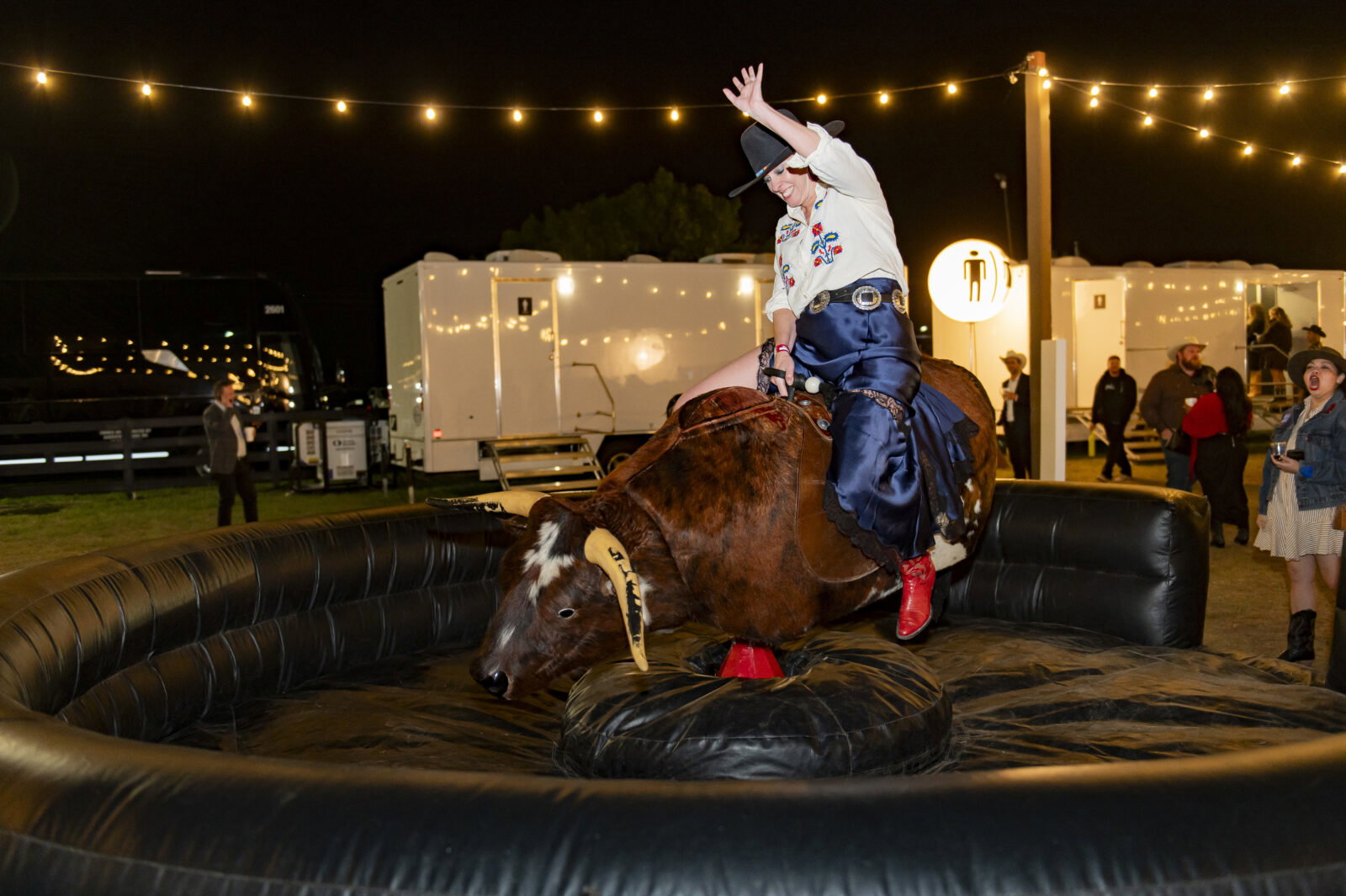 Guests took a turn on the mechanical bull (Photo by Tamytha Cameron Photography)