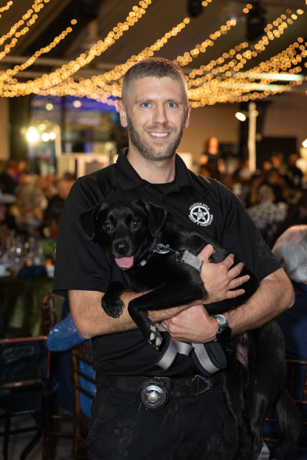 Houston SPCA Senior Animal Cruelty Investigator Ben Kircher and the puppy Timmy at Houston SPCA's 2026 Howl-O-Ween Ball (Photo by Wilson Parish)