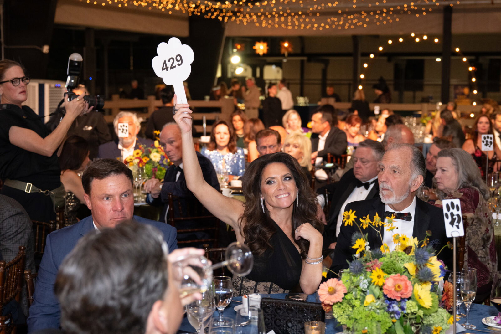Joanna Hartland joins the 'Paws Up' fundraising at Houston SPCA's 2026 Howl-O-Ween Ball (Photo by Wilson Parish)