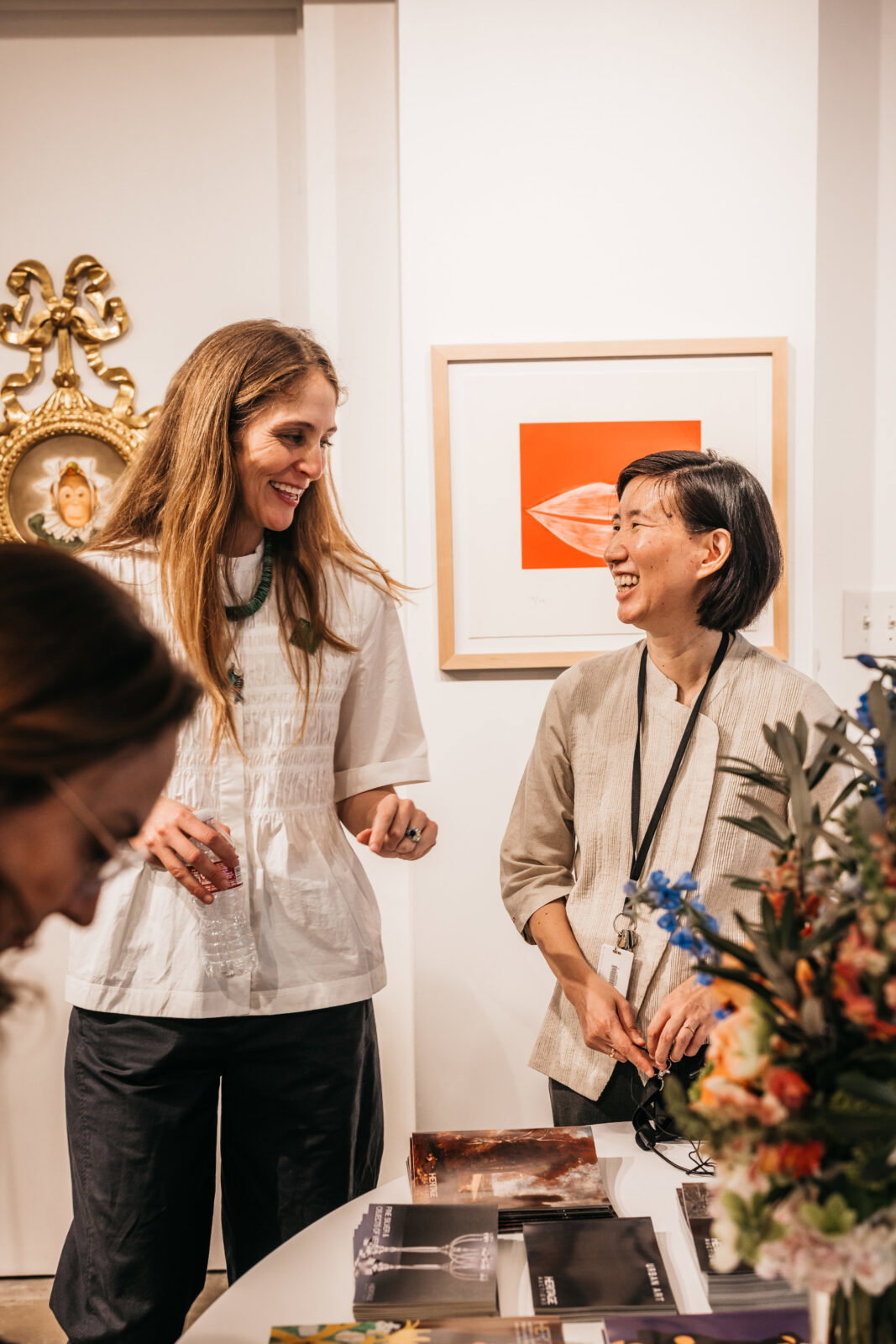 Dallas Art Fair director Kelly Cornell, Dallas Museum of Art's Dr. Vivian Li check out a booth in search of artwork for the DMA Acquisition Fund. (Photo courtesy of Dallas Art Fair)