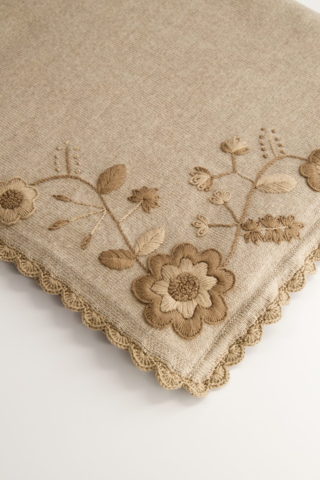 Mi Golondrina's Taupe Shawl ($495), a versatile wool shawl featuring floral embroidery from San Juan Chamula and a hand-crocheted border from Huixtán. (Courtesy of Mi Golondrina)