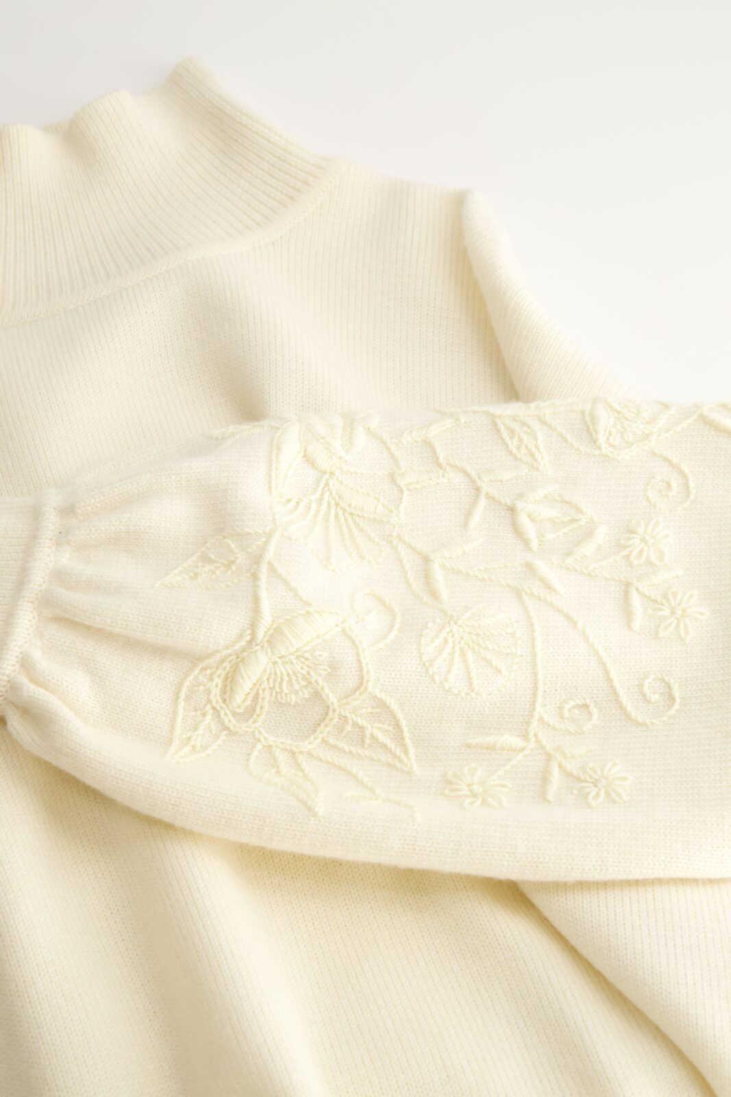 Mi Golondrina's Ivory Turtleneck Sweater ($495), a cropped silhouette with full balloon sleeves and tonal floral embroidery, completed in Zinacantán. 
(Courtesy of Mi Golondrina)