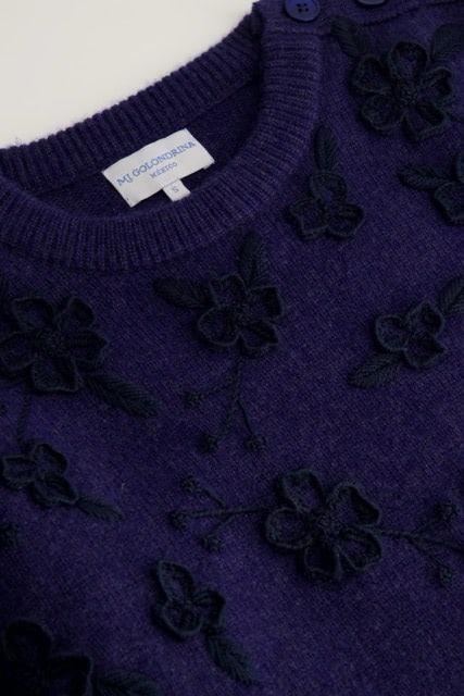 Mi Golondrina's Navy Floral Crewneck Sweater ($475), a tonal navy wool sweater featuring dimensional floral embroidery, completed in San Juan Chamula. (Courtesy of Mi Golondrina)