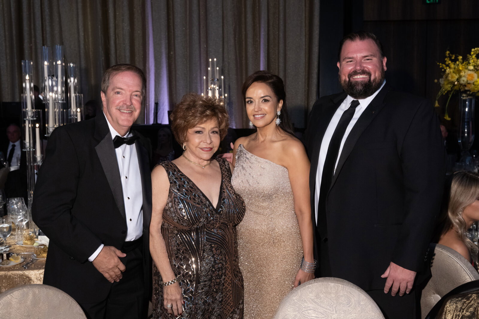 Porsche winners Phillip Royalty & Trini Mendanhall Royalty with Porsche's Maria Moncada Alaoui and Robert Dale at Houston Children's Charity gala (Photo by Priscilla Dickson)