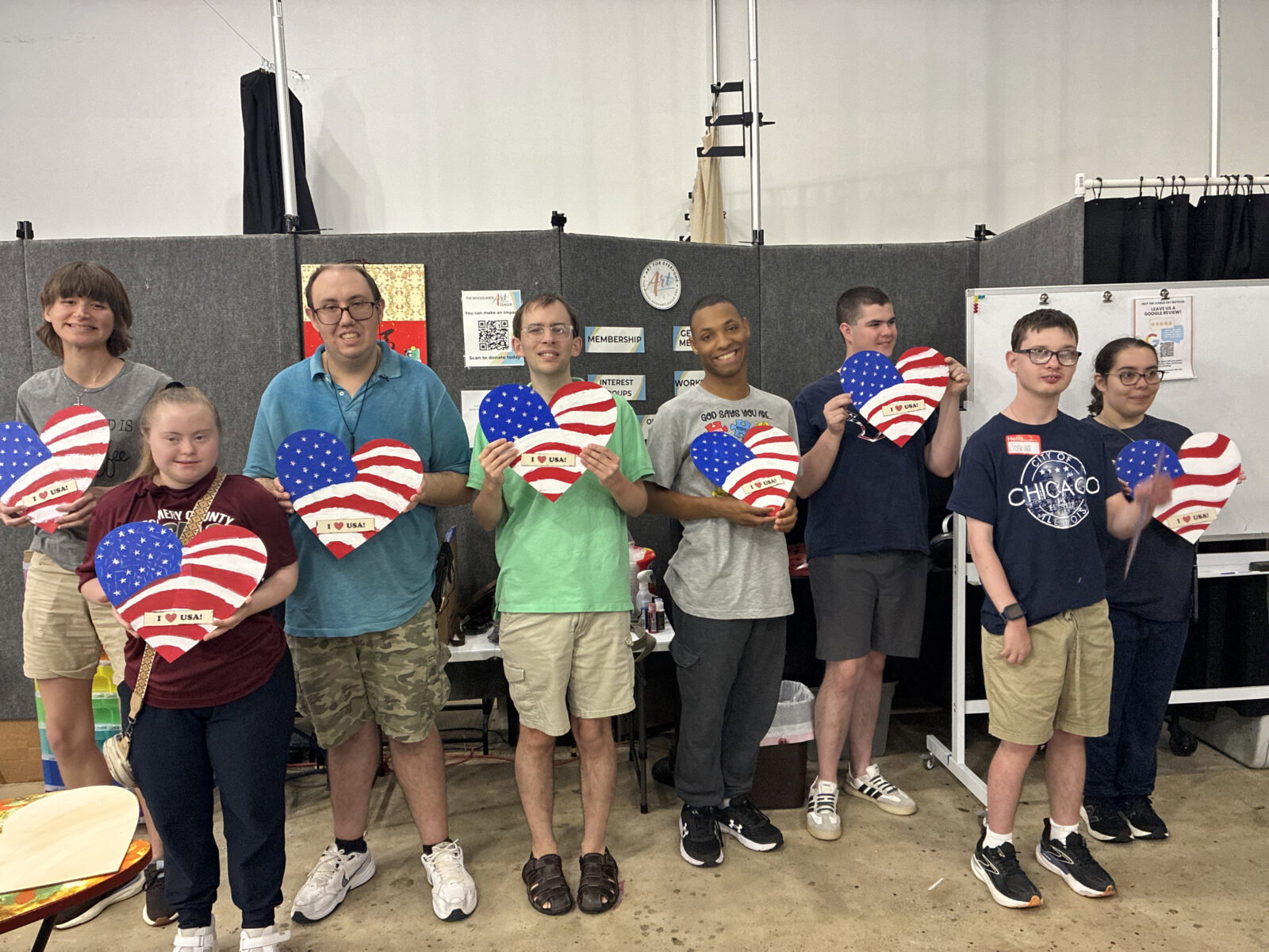 Project Beacon clients with the art they produced at The Woodlands Arts League studio, courtesy of The Pavilion's Big Idea grant. (Photo courtesy of Project Beacon)
