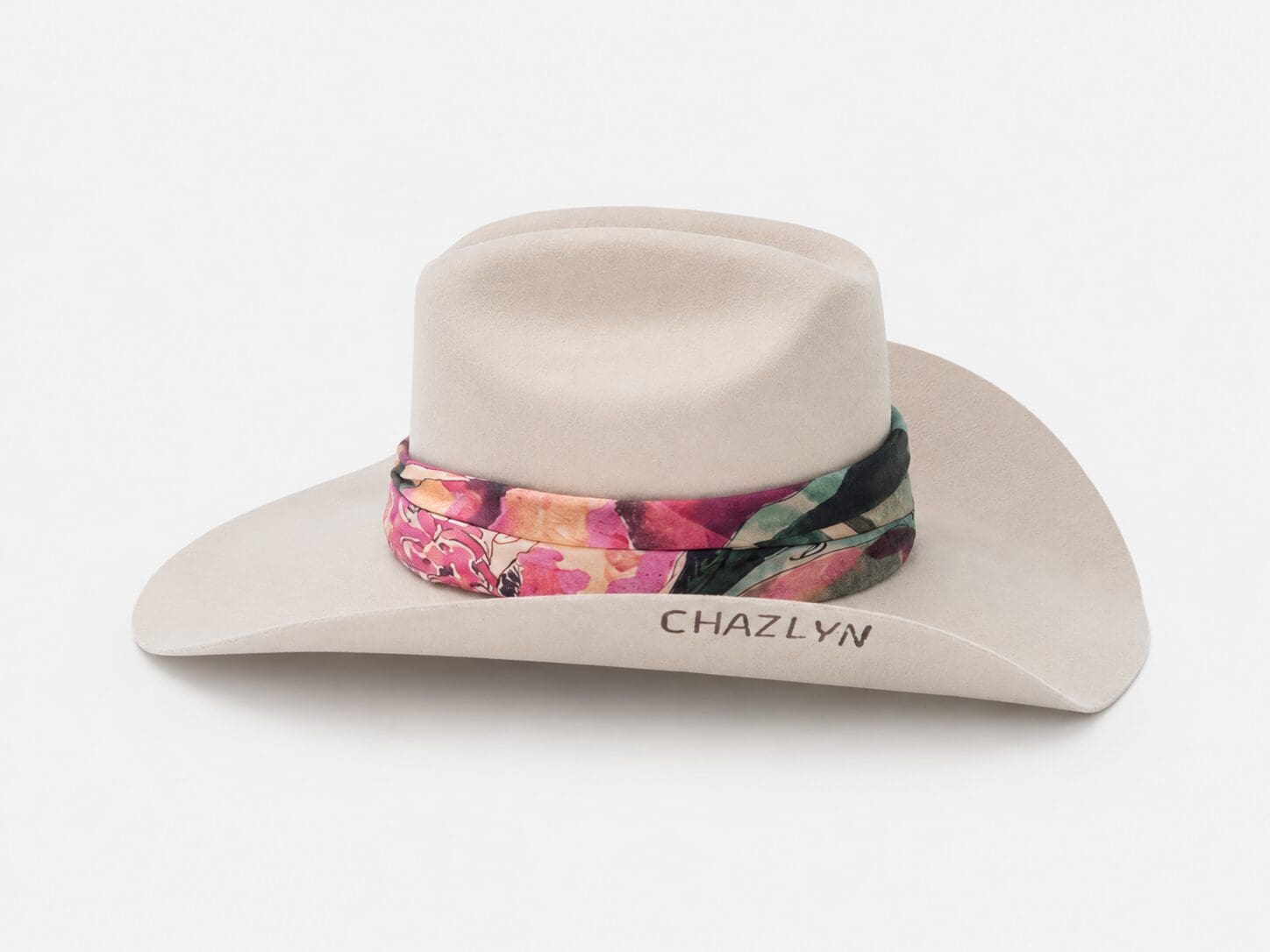 A silk scarf featuring artwork by Chaz Pilarcik’s mother adds a personal touch to a Western staple. (Photo by Nick Glover)