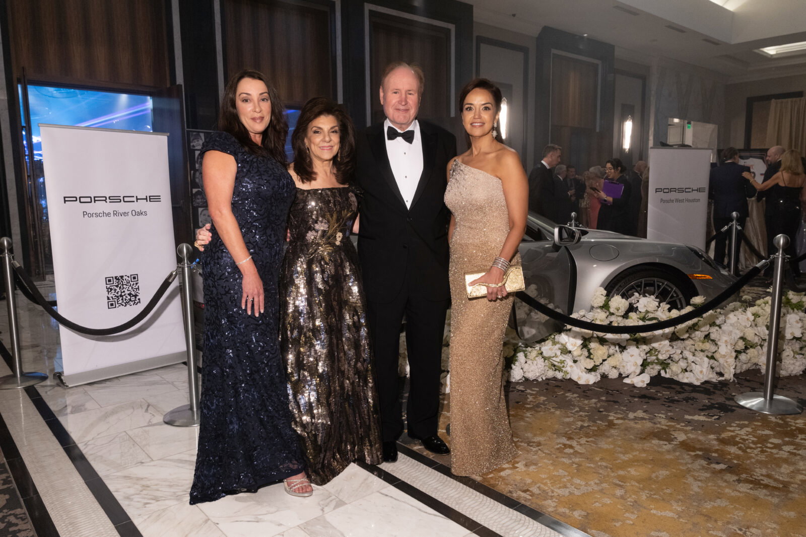 Title sponsors Porsche River Oaks and Porsche Wesst Houston Marianna Brasel, Houston Children's Chairty president and CEO Laiura Ward, honoree Gary Petersen, Maria Moncada Alaoui at Houston Children's Charity gala (Photo by Daniel Ortiz)
