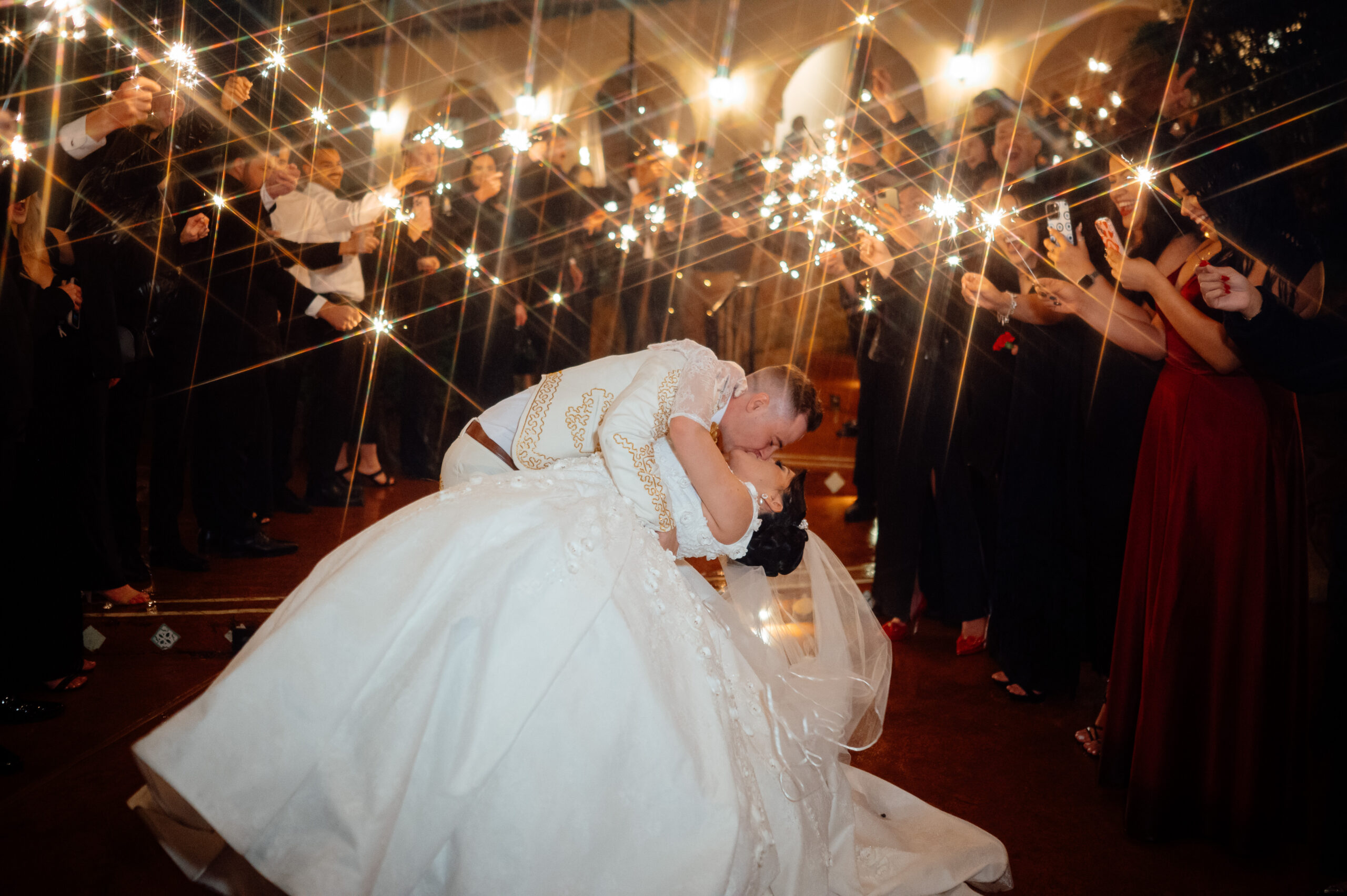 Guests made good use of the sparklers, and raindrops just added to the beauty of this wedding night.