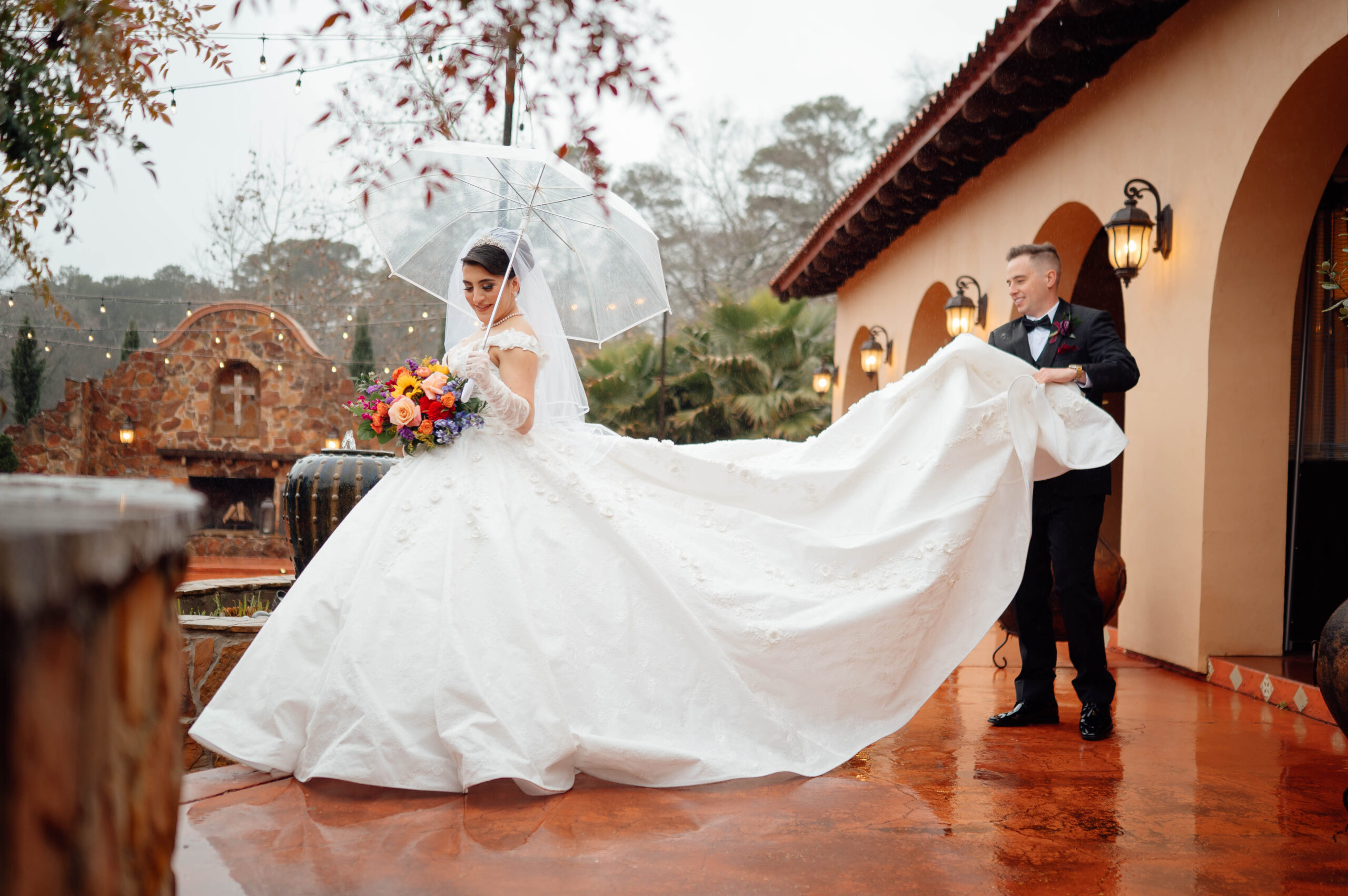 Gracie and Ethan didn't let a few raindrops get in the way of a beautiful celebration. The ceremony was moved indoors. And this beautiful dress almost caught on fire.